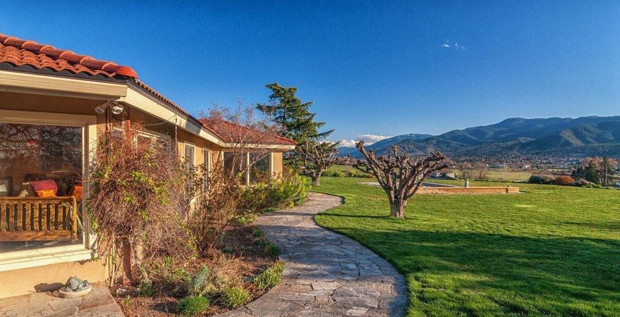 A phenomenal Estate property with unparalleled 360 degree views overlooking the city of Ashland, the Valley, including Mt Ashland. The two single level homes on this Estate are nestled on 36+ acres of lush, private, irrigated land. The beautiful main home is sunny and filled with light. Several of the rooms open to the outdoors where the trellised patios, inviting pool, hot tub, Koi pond and waterfall beckon. A gracious dining room enjoys amazing views and can seat ten people. The chef's kitchen can accommodate more than one chef. The Master Suite has been beautifully renovated including the spa-like bath, with a see-through fireplace. A charming 2 bedroom cottage is privately located on the other side of the property.