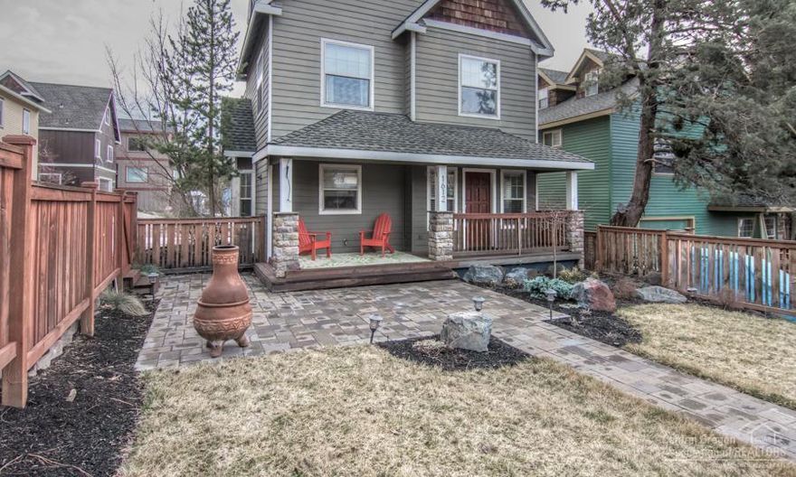 Live within walking distance to everything West side. The front courtyard with extensive paver patio invites you inside to a charming open floor plan downstairs. Three nice sized bedrooms on second level boast quality built-in closet systems. Spacious back deck off of the master suite with french doors for enjoying the morning sunshine. The bonus room on the top level provides versatility for media room or office. Plenty of built in storage in garage plus attached 8x10 shop area for your home projects