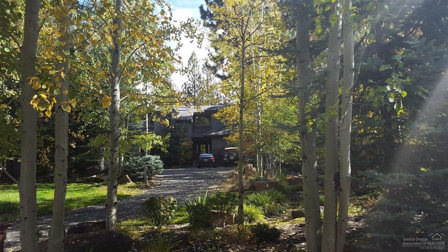 The best of Broken Top perched above the signature fairway and located on the coveted Bunker Hill Ct. Offering privacy amongst mature landscaping with towering pines and aspens. This custom built home from Sun Forest Construction was thoughtfully designed to allow plenty of light and to bring the outdoors in. The large great room offers floor to ceiling windows w/French doors leading to the patio. Listen to the crackling fire from the wood burning fireplace and you may not even feel the need to go camping.