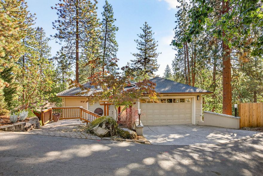 Quality built contemporary home placed among the madrone and pine trees in the hills of beautiful Ashland OR. Versatile, user-friendly floor plan with many unique architectural features. The cozy living room w/ fireplace, kitchen and dining area surround a well-designed multi use pantry closet. Soaring open beam ceiling above leads to a wall of windows allowing for natural light and views of the trees and mountains afar. Two spacious decks to enjoy the natural setting. Main level has an artistically designed room with a spoke pattern beam ceiling, custom lighting, handcrafted shelving and a full bathroom. Lower level you will find a large spa primary bedroom suite w/ private patio, attached office/ reading room with access to the lower deck. Bathroom has double vanities, a soaking tub and radiant heat floors. Two additional bedrooms, a full bath and a laundry room are also on the lower level. Perfect for the outdoor enthusiast w/ hiking trails just a few feet from the front door.