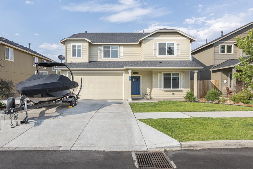 This stunning home is located in the desirable SE side of Bend in the Bailey Estates Subdivision. You'll appreciate the close proximity to lots of shops, restaurants, and easy access to the parkway. Walking in to this craftsman-style home you'll find an open floor plan, featuring a stunning kitchen with freshly refinished cabinets, quartz countertops, full tile backsplash, stainless steel appliances, large island, and pantry. Open the door to a welcoming entry with lots of light and an office/den/5th bedroom on the main floor with four other bedrooms upstairs, two and half bathrooms, an inviting gas fireplace, convenient upstairs laundry, as well as a large primary suite with walk-in closet and luxurious master bath. The exterior truly shines with two car deep set garage, fully fence yard, covered back patio area, a 10 ft x 16 ft workshop with vacuum system, and nice sized yard with front and back underground sprinkler system. Come meet your new home!!