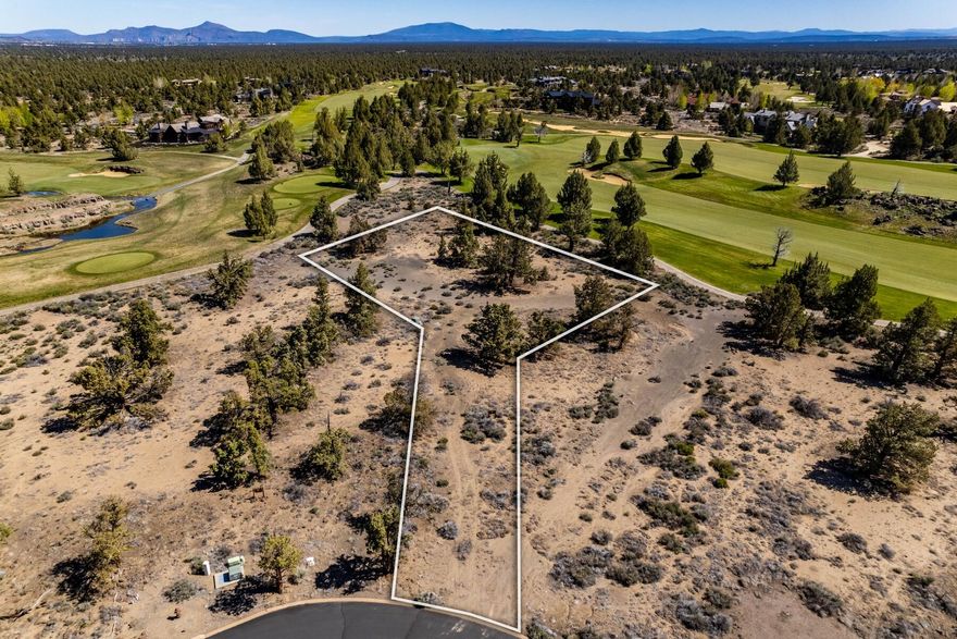 Discover one of the most exceptional homesites within Juniper Preserve Resort. This nearly one-acre parcel is perched on a private point,  positioned between Tom Fazio's iconic holes #10 and #11, this site offers stunning water features, sweeping fairways, and breathtaking Cascade Mountain views—an unparalleled backdrop for your dream home. The Club at Pronghorn is truly  Central Oregon's Premier Golf Experience. Live where you play, with effortless access to world-class golf and resort amenities..Private Member's Club, Village Market, Pools, Fitness Center, Day Spa, NEW fine & casual dining, Scenic Bike Trails, a dedicated Dog Park, and more! $90,000 toward Club Membership is Included!