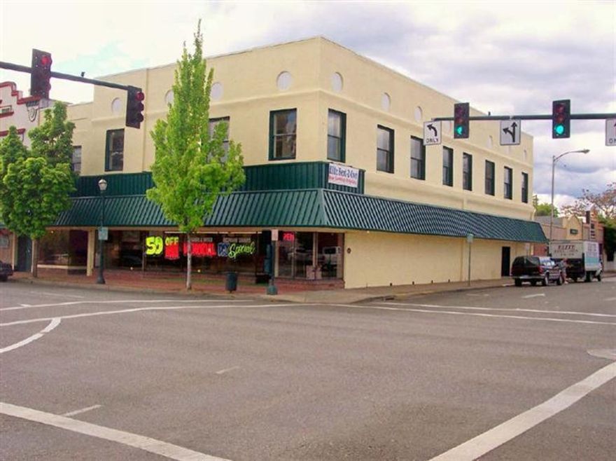 High traffic location at the corner of E & 6th Streets in Grants Pass. 12,844 sq. ft. with mezzanine & 2 floors plus partial basement. Could be used for offices, retail, warehouse space or whatever you can think of that needs great exposure in the center of town. Each floor has bathroom facilities & storage area. Possible to split the 2 tax lots with the 2 existing entrances; great potential for any number of uses. This commercial property won't stay on the market for long.