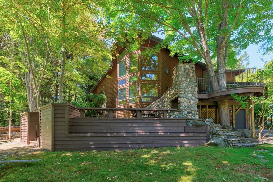 Views for days + riverfront dreams! This beautifully maintained home fronts the legendary Zane Grey fishing hole—one of the best on the Rogue. Main level: primary suite, living, kitchen, library/office. Basement level: huge media room. Upstairs: guest bedrooms & space to spread out. Outdoors: waterfall pond, vintage guest cottage, playground, multiple decks w/rock fireplace & pizza oven, private primary deck, sunroom, dumbwaiter, & more—just steps from Pierce Riffle Boat Ramp. $1,375,000 (add adjacent lot for $75K off!).