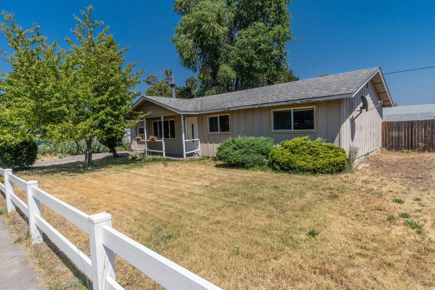 This ranch-style home on a quiet cul-de-sac is just waiting for your touches to bring it up to date. This home offers an easy, semi-open layout, laminate floors throughout, and lots of natural light. The living room features a large picture window to the front porch, as well as a rustic woodstove and shiplap paneling. The kitchen is open to the dining area, which has sliders to the large fenced backyard. On one end of the home, find 3 bedrooms and a full bathroom. On the other end, the garage has been converted to a 4th bedroom, 3/4 bathroom, and large laundry room. Outside, two sheds offer plenty of storage for sports equipment
and tools. The established North Pilot Butte neighborhood offers mature trees and quiet streets. Enjoy easy access to Hollinshead Park, St Charles Hospital, and more. Home is being sold in AS-IS condition. Come make this charming home your own!