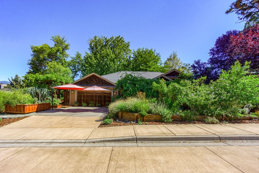 Rare, one owner, single level home w/ extraordinary detailing both inside & out. Vaulted great room w/ fireplace & wall of windows overlooking the private, manicured rear patio. Newly remodeled kitchen w/ custom African Mahogany cabinets, amazing storage & a stunning center island. Spacious Master w/ fireplace, direct patio access, a well-appointed bathroom & enormous dressing room. Versatile floorplan features 3 bedrooms plus an office/art studio & flexible entrance points. Great work-from-home set up in the converted oversized garage space. The setting is one of the most impressive in Ashland. Stone patios including a bridge over a recirculating Koi pond & water feature. Outdoor entertaining is second to none; Mahogany wet bar, lush landscaping w/ year-round color. Extensive decking with decorative pergola, Sauna, mature trees & shrubs, plentiful fruits & vegetables including mature grape arbor along the entry. Additional off-street parking. Raised garden beds. A true masterpiece.