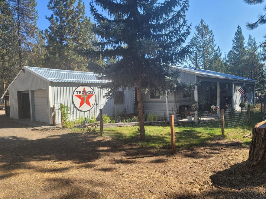 Newly remodeled home in the trees. This beautifully redone manufactured home is move-in ready!  On over an acre this property offers the secluded privacy of the outdoors with the convenience of being close to town. With a large detached garage several powered outbuildings and a pole barn style roof protecting the main buildings. The property also comes with deeded access to the Williamson river on two gated private lots this one is not going to last long call to make your appointment today!