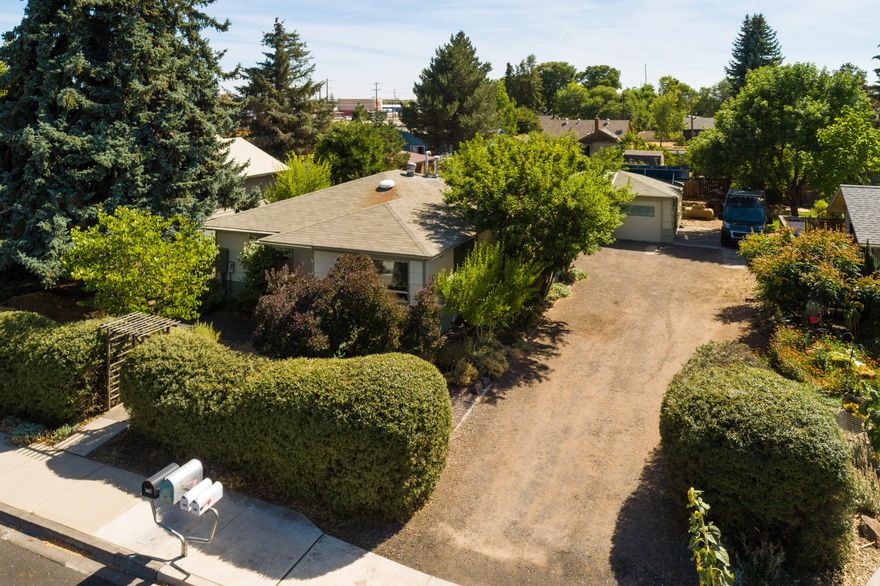 More than just a quiet, well-constructed, and beautifully maintained home, this property allows you to pay less than $20 a month in utilities, garden to your heart's content, and tinker in the heated shop/garage all year long. When you add the investment potential given the quiet location, higher density zoning, and oversized lot, this three-bedroom, one-bath home is a natural choice for many different reasons.