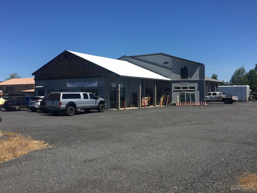 2.24 acre light industrial with first class offices and shop spaces. Building sits on .86 acre lot. Adjoining 1.38 acre parcel is gravel surfaced and fenced. Seller is vacating center shop space and 5 offices with 2 3/4 baths totaling approx 3,257 sq feet for new owner to use or lease. Vacant parcel has outstanding potential for vehicle storage, mini storage or subdivision.