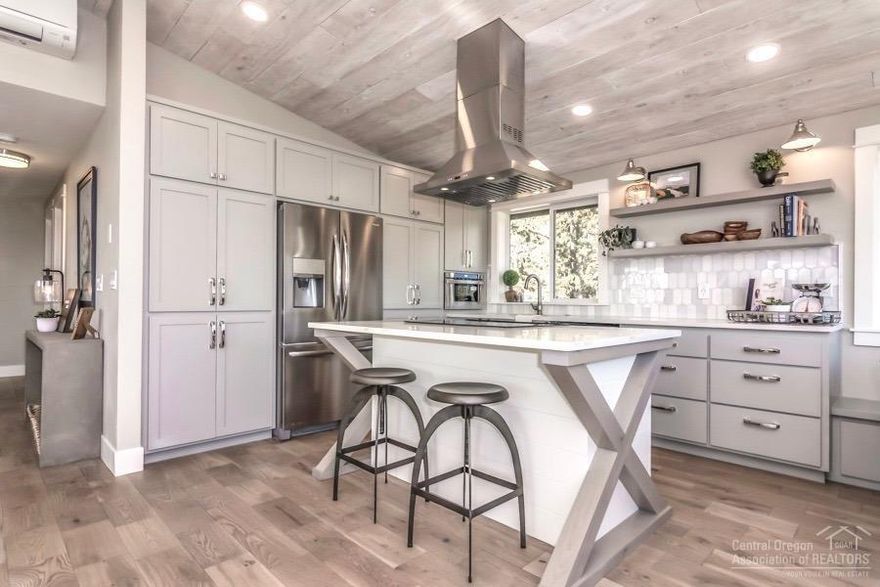 The one you've been waiting for, country feel yet still in town! Unbelievable views! Whole house renovation 2018. Split level 4 bed 3 bath on .48 acre! New flooring throughout. Master bath with tile floors and shower and marble counter tops. New composite upper and lower decks. Brand new kitchen with quartz counters, marble back splash, SS appliances, motion sensor sink, soft close cabinets, and built-in banquet bench with storage! Walk out from your kitchen onto your upper deck with your morning coffee and watch the sunrise over the Rimrock. New mini split high efficiency ductless heat pump. New exterior paint and decking, RV parking, room to build shop. One of a kind with a priceless views.