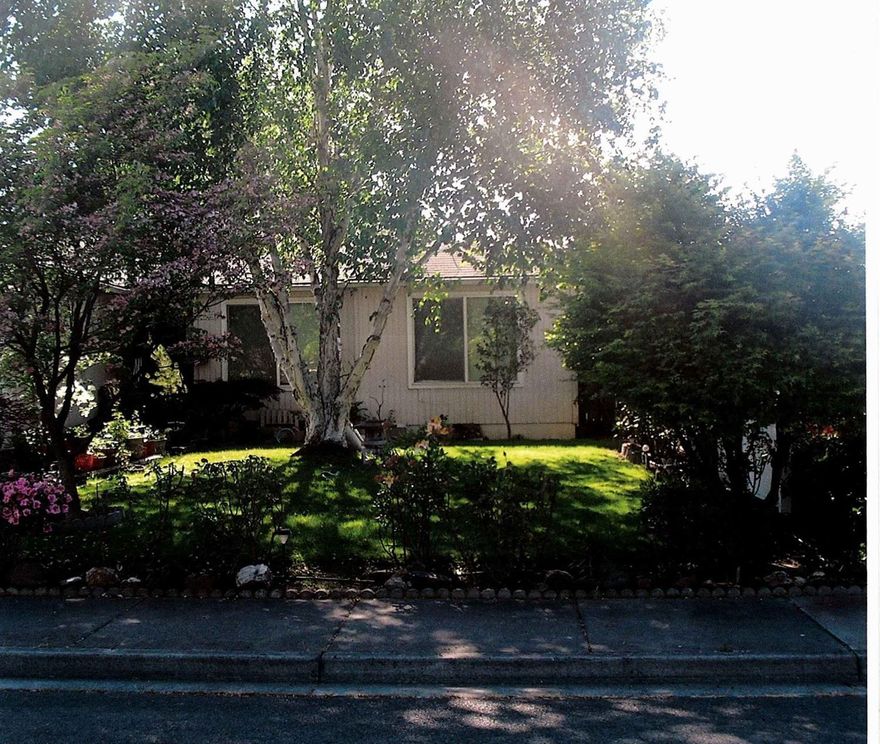 Gardener's Heaven! Free greenhouse with purchase! 3 bedrooms and 2 full baths on a quiet street in a nice SW Medford neighborhood. A high coffered ceiling in the great room gives it a spacious feeling. Lots of kitchen counters and a huge walk in pantry for cook's delight. Dining area with patio access. Raised beds in the back with 2 apple trees, a pear tree, concord grapes, marion berries, strawberries, blueberries, raspberries, and more! Nicely established landscaping with several dogwoods and roses in the front yard! Underground sprinkler systems front and back. The master bedroom has a walk in closet. The attached 2 car garage is fully insulated and finished. There is new flooring in the hall bath and it has new paint inside.