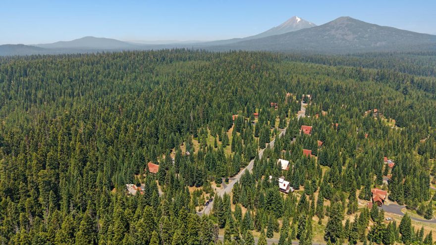 Offering seller credit. Turn-key mountain retreat in the desirable Lakewoods Subdivision—just 4 miles from the south end of Lake of the Woods & 7 miles from the resort. Custom-built chalet on a private, wooded 1-acre lot with direct access to neighborhood trails that connect to Lake of the Woods and the Pacific Crest Trail. Optional furnishings, snow blower, and home generator make move-in or rental setup a breeze. 4 bedrooms, 4 full baths, plus a loft offer plenty of space for family, guests, or Airbnb potential. The great room features 32-ft vaulted ceilings, a gas fireplace & massive windows that frame forest views. Wide plank hardwood floors, granite kitchen counters, premium appliances & ample storage throughout. Vaulted master suite with private deck & spa-style bath. 1600 sq ft wrap-around deck, custom dog yard & oversized tandem 3-car garage—perfect for storing all your outdoor gear and toys. Year-round recreation right outside your door!