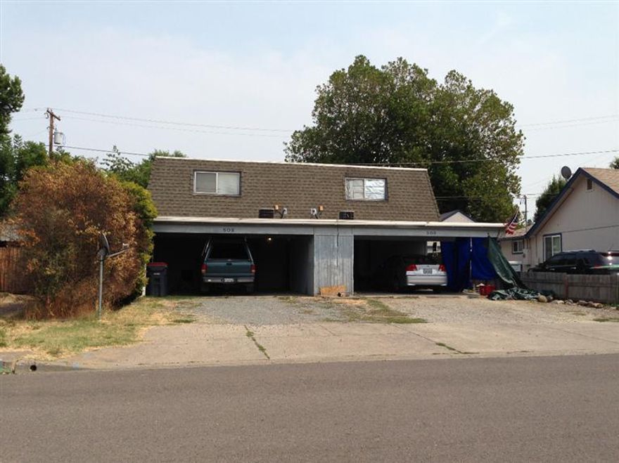 Duplex in a very convenient location, close to Hedrick Jr High School. Two, 2 bed 1.5 bath Townhouse style units plus large carport for each side. Laundry hookups in Kitchen. Sliding door access to fenced back yard area. Unit 508 has newer carpets. Some TLC needed here. Hard to find property, priced to sell!