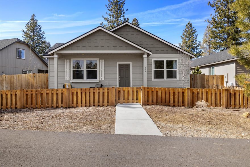 Welcome to this delightful 3-bedroom, 2-bathroom home located in a desirable neighborhood just a short distance from downtown Sisters. Boasting 1,609 square feet of thoughtfully designed living space, this home offers a perfect balance of modern comfort and small-town charm. The spacious open-concept living area is ideal for both entertaining and everyday living, with a cozy fireplace adding warmth and ambiance to the living room. The adjoining dining room and kitchen create a welcoming flow. The expansive primary suite features a large walk-in closet and an en-suite bathroom with a dual vanity, ensuring plenty of space for your personal items and a peaceful retreat at the end of the day. Step outside to your private patio space and enjoy the fully fenced yard—perfect for pets, play, or relaxing in the Oregon sun. The home is located directly across from a lovely community park, adding to the appeal of this location.