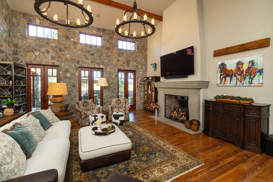 This exceptional estate in the prestigious Juniper Preserve Resort is nestled within the exclusive Pronghorn Community. Spanning 0.48 acres, it blends luxury, comfort, and elegance for a one-of-a-kind living experience. The 5,118 sq ft home includes a 615 sq ft casita, perfect for guests or a private retreat. The main-level primary suite opens directly to an outdoor spa, while two upper suites access patios with stunning views. There are four opulent bedroom suites in total. The chef's kitchen features a prep pantry and wine cellar. Natural stone and wood accents lend timeless character throughout. A south-facing covered patio with a wood-burning fireplace offers year-round enjoyment. Car enthusiasts will appreciate the 1,328 sq ft garage with room for three cars and a golf cart. Enjoy all the gated community offers, including two championship golf courses at Pronghorn—where luxury meets lifestyle.