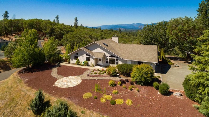 Amazing view home...! Enjoy your 5 Southern Oregon acres with beautiful mountain, valley & meadow views from your large back deck, lower concrete patio, or front yard. That's right...there is almost a 270 degree view with this North Valley Estate home. Great family home floor plan, perfect for entertaining. This 3118sf, (Assessor), home features 3 bedrooms, 2.5 baths, & large 2 car garage with a detached workshop or craft area. Other features include vaulted ceilings, spacious kitchen with center island, open living area, large bedrooms, ceramic tile floors in the entry, & a finished daylight basement with a media room and family room, complete with pool table. All information deemed reliable. Anyone interested in the purchase of this property should perform their own investigation into use and condition. See virtual tour.