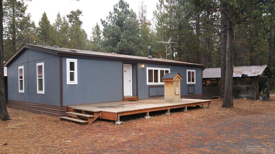 Great Opportunity to own a home in Beautiful Central Oregon. Fenced 1/2 Acre Corner Lot with Circular Driveway. Vaulted Great Room with Ceiling Fan. Oil Monitor & F/A Electric Heat. Master Bedroom with Bathroom and Walk In Closet. Utility Room with Sink. Detached 2 car Garage. Green House, Man Cave and Storage Shed. Sears Water Filtration System, Located within minutes of Community Boat Ramp to the Big Deschutes River, Sunriver Resort, Mt Bachelor & Cascade Lakes.