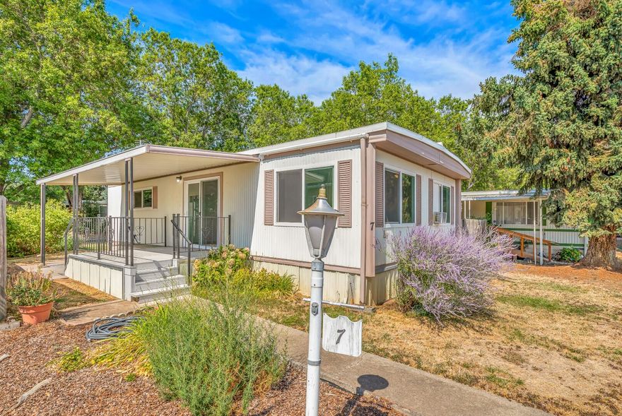 Looking for a move-in ready home at an inexpensive price? If so, this is the one for you! This turn-key property features 2 spacious bedrooms, 1 full bathroom, 800 sq ft (assessed per seller), large living room, newer patios, double paned windows, detached carport w/ additional storage, and much more! Per seller, their is a lifetime warrantable roof and new thermostat to be installed as well. Both bedrooms have walk-in closets. Space rent is $525 per month and this is a 55+ park that is continually well maintained throughout the year! This one won't last long on the market, so contact your agent today for a personal tour, before it's too late!
