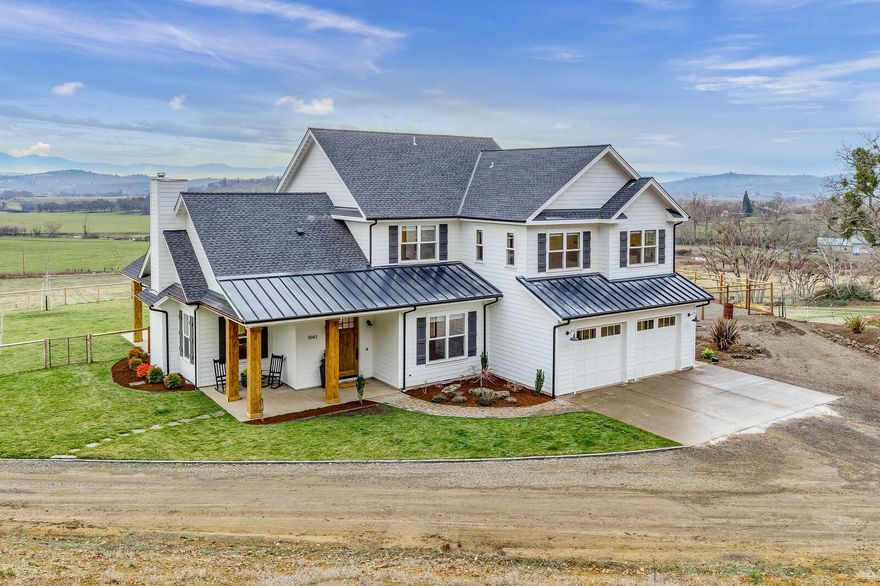 This Modern Farmhouse will not disappoint! Stunning views and a gorgeous home are right here and waiting for you.  This 3600+ sf home feels warm and inviting. Gorgeous floor to ceiling shiplap walls and luxury Restoration Hardware lighting. Open kitchen blends with the dining space, vaulted living room with exposed brick wood burning fireplace.  The kitchen is the epitome of luxury featuring stainless steel Wolfe appliances, white cabinetry and quartz countertops and huge pantry.  You'll also find an office + separate family room downstairs.  Upstairs: vaulted Master Suite,  free-standing soaking tub with views of pastures ,walk in shower and double vanity. The 3 extra bedrooms are all graciously sized. EFU zoned irrigated land. BarnPro Olympic brand barn w/ 6 stalls + 1700 sf finished space above. Huge 2000sf shop w/roll up doors. Pole barn, Custom chicken coop and Irrig. at the flip of a switch! Solar panels and RV hookup area.