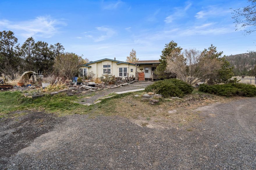 Enjoy 78 acres of privacy in the coveted McKay Creek Valley of Prineville.  This private oasis, just minutes from town, features a well-maintained 4 bedroom, 2.5 bath home, abounding with natural light and space.  The 2874 sq ft home is light and bright throughout with an open layout kitchen/ living room and all the extras; dining area, breakfast nook, family room, mud room, and primary suite complete with walk-in closets and soaker tub. Outside  offers abundant room for all of your animals and toys! Property is ready for livestock, fenced and cross fenced, Chicken coop and complete with a massive 2400 sq ft shop and additional outbuildings. This property is what Central Oregon dreams are made of!