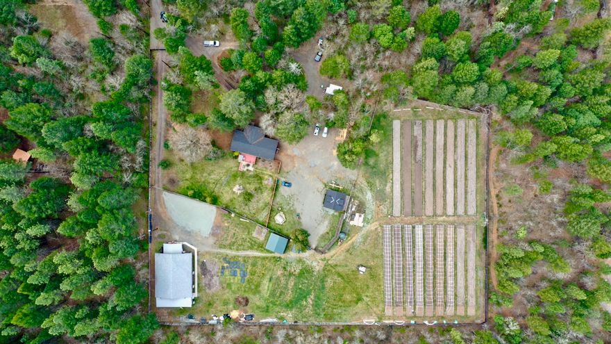 Ready to live the Southern Oregon dream? Work, live and play all at your doorstep in the world-renowned emerald triangle. Step into this efficiently run, clean and well organized, Tier 2 mixed-use OLCC farm with top shelf strains, working industry relationships, and detailed SOP's. This farm boasts 4.5 ac of year around use nursery water rights, full sun, and dialed-in indoor facility for that perpetual harvest and income. The indoor has 3 flower rooms, an immature canopy space, and soon-to-be tissue culture lab. The outdoor gardens are split into light dep hoops and a full-term canopy space with lots of organically amended soil and automated watering and fertigation system. Trim, dry, cure, and storage space complete this turn-key business. The property also includes a well kept updated 3 bed 3 bath home for you or your employees with a new kitchen, flooring, and remodeled bathrooms. Hurry the season is upon us!