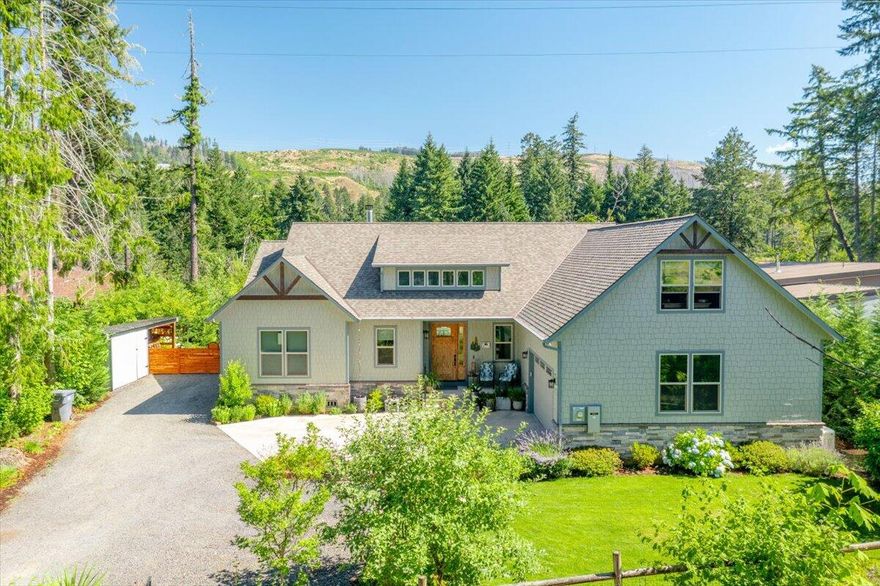 Enjoy elevated comfort in this custom ''Little North Fork River'' home with 100 ft of river frontage. Crafted with upscale finishes, vaulted ceilings, and 12-ft sliding glass doors, this 3-bed, 3-bath haven features a private office, gourmet kitchen, striking stone fireplace, and an 880 SF bonus room. Outdoor living is a highlight with 1,400 SF of composite decking, a perch deck with gazebo, manicured landscaping, and a charming 192 SF studio/cabin. Includes backup generator. A rare riverfront treasure!

Serenity, comfort, and riverfront luxury define this exceptional home. Set on a beautifully landscaped lot with your own River access, this property offers the perfect blend of elegance and outdoor adventure. Enjoy the river all summer with included river toys or relax on the expansive decks and take in the peaceful surroundings.