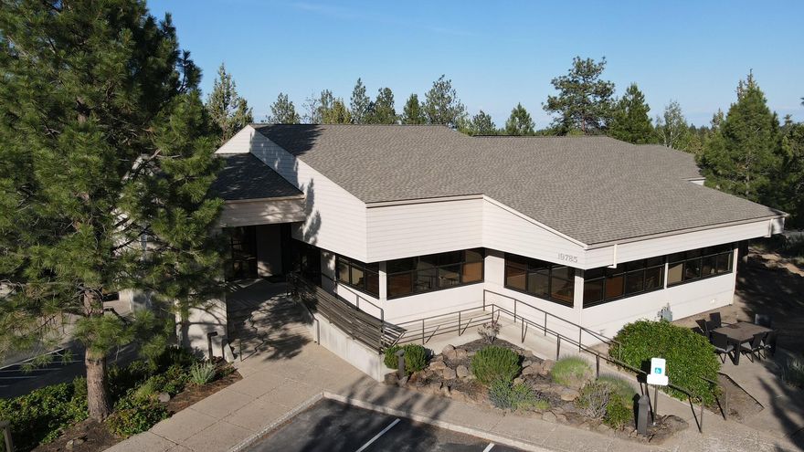Professional Office/Medical Building For Sale. Exceptional owner/user building designed by Bend architect Neal Huston. Architecturally modern design nestled within a very unique pocket of land known as The Office Park @ Mt. Bachelor Village. Located above The Athletic Club of Bend, gorgeous setting. 8,971+/-RSF building, 0.76/CL Zoned Lot, 10 private offices, one conference room for 12, full kitchen, elevator services bldg., 29 shared parking stalls, separate shared locker room with private lockers, ADA compliant shower and 3 restrooms split for for men/women. Two mini-splits in the breakroom, 1 in private office and server room. The setting provides lots of natural light w/skylights, nature comes through every window-impressive use of wood and sloped ceilings, meticulously maintained and professionally managed property. Outstanding owner/user building with some cash flow. Easy access to Old Mill, walk to the Athletic Club of Bend, close to Farewell Bend Park and the Deschutes River