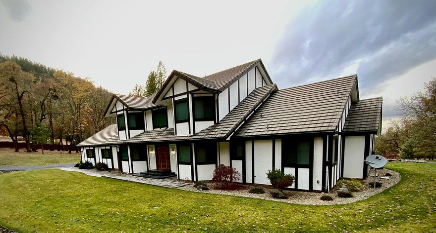 Discover an extraordinary estate that redefines luxury living! Nestled on over 7 acres in the coveted Country Hills, this meticulously remodeled 6-bedroom, 5-bathroom home offers 3,831 square feet of elegant living space. Behind a private gated entry, the property welcomes you with lush, professionally landscaped grounds, a tranquil pond, and a dazzling pool, creating a personal resort-like ambiance. The main house features an open, light-filled layout with high-end finishes throughout. The chef's kitchen is a showstopper, boasting WiFi-enabled Thermador appliances, an expansive island, and abundant cabinetry, perfect for entertaining. The luxurious main-floor primary suite includes a spa-like bath with a jetted tub and custom tile shower. Upstairs, find additional bedrooms, a cozy sitting area, and a second en-suite for guests.
An impressive 5-car garage includes a full apartment and workshop space. This property is a true haven for discerning buyers.