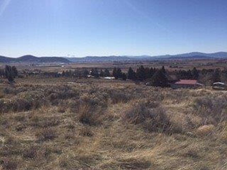 Gorgeous homesite in desirable Pine Grove. 1.68 acres ready to build the home of your dreams! Approved for septic and access to community well, this great lot is waiting for you. Gorgeous, sweeping views of the Basin and Mt. Shasta await!
