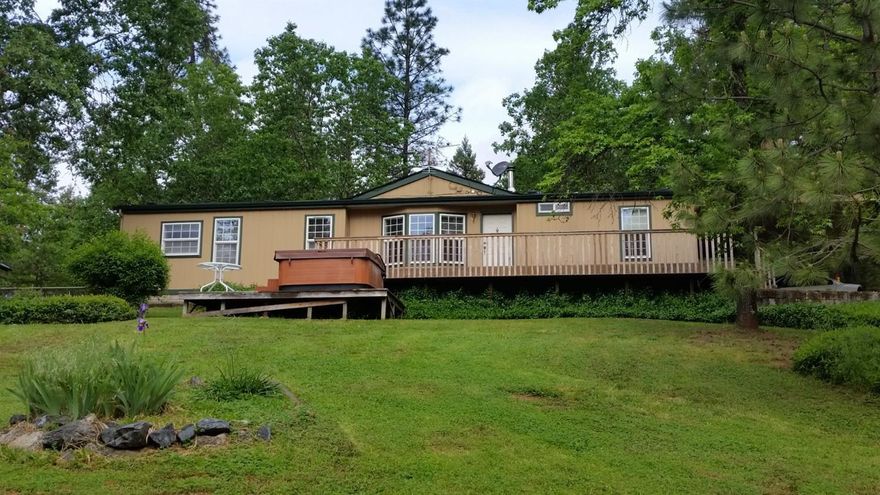 Nicely kept 3 bed/2bath double wide manufactured home, 4th room for office or possible bedroom. Newer heat pump, roof,deck and painted in 2015. Hot tub had new cover 2017. Shop is approx. 16x30 with carport. Gable barn with hay loft and equipment ports on the side. Property is fenced and cross fenced with fenced garden area. Backed by BLM.
