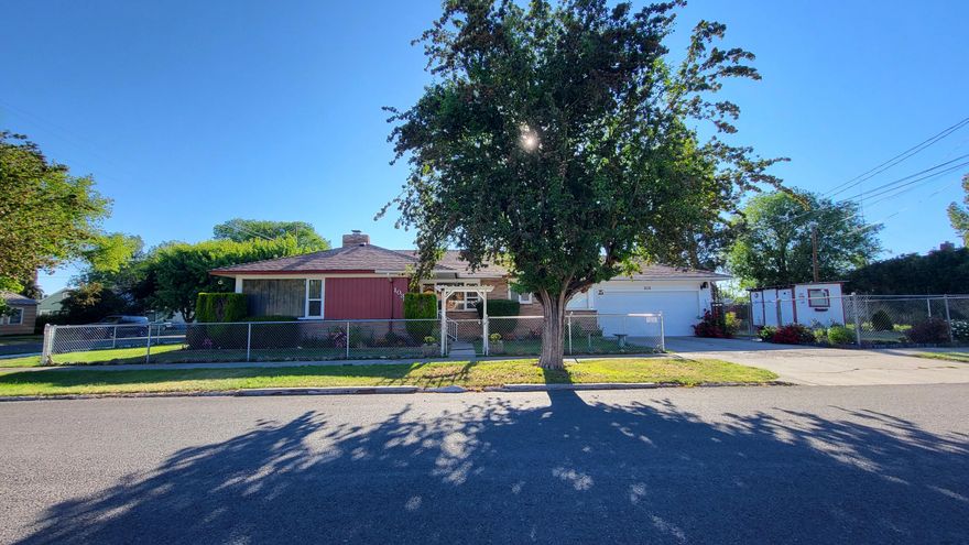Clean and updated 2 bed 1 bath home! The original hardwood has been beautifully maintained and matches the natural brick and vintage style and design of this home! Lots of updates and upgrades the last few years from the current owners! New 30 year roof in 2019, New garage door in Feb 2020, New Fridge 2020, New range 2021, New storm door off garage 2020, New flooring in bathroom 2022, and the yard has beautiful landscaping! The flower beds have many rose bushes and other gorgeous flowers that are currently in bloom. Enjoy the natural shade that the front trees provide for the early to mid morning hours on the front of the home. Nice corner lot as well and the yard is fully fenced! There is also a shed, possibly a she shed? Come see this incredibly kept up home and make your offer before someone else beats you to it!
