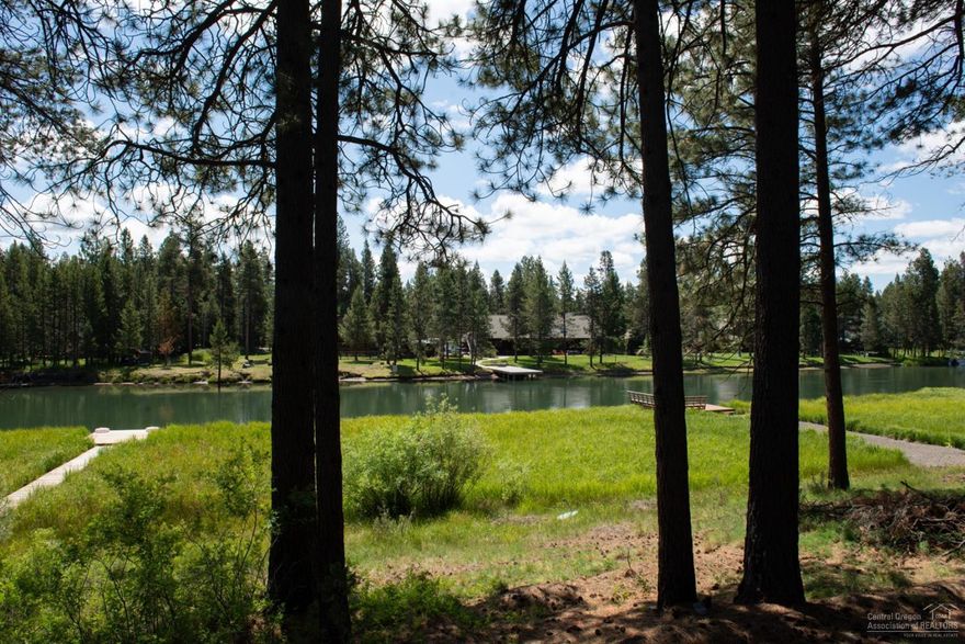 It is here, the property you have been waiting for. True riverfront living. Perched above the Deschutes River enhanced by a lazy trail down to the dock for direct river access. Nature abounds here in this peace and tranquility. All just a few miles from the Resort, and City, of Sunriver and the Cascades Lakes Highway leading to Mt. Bachelor and outdoor recreation. And also included is a separate lot with a 1000 sq. ft. shop, the ultimate man-cave'' including 300 sq. ft. of additional loft storage, pickle ball courts and RV storage. House is cozy, and would love to see some improvements.