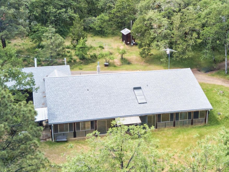 A peaceful life on 31.35 acres awaits in the heart of White City's farm zoning! Minutes from modern conveniences, yet offering peace, quiet, and connectivity with nature, this house was built to be energy efficient in a Berm style, featuring full length sunroom/ greenhouse at the front and a solar preheater on the roof for hot water. Enjoy picturesque views from nearly every room in the house as you become one with the paradisiac surroundings. With most of the roof facing south, it's the perfect spot for solar panels, further lowering your impact on the surrounding environment. The upstairs is just awaiting your ideas and determination;  currently enjoyed as a separate area, yet the possibilities are endless!