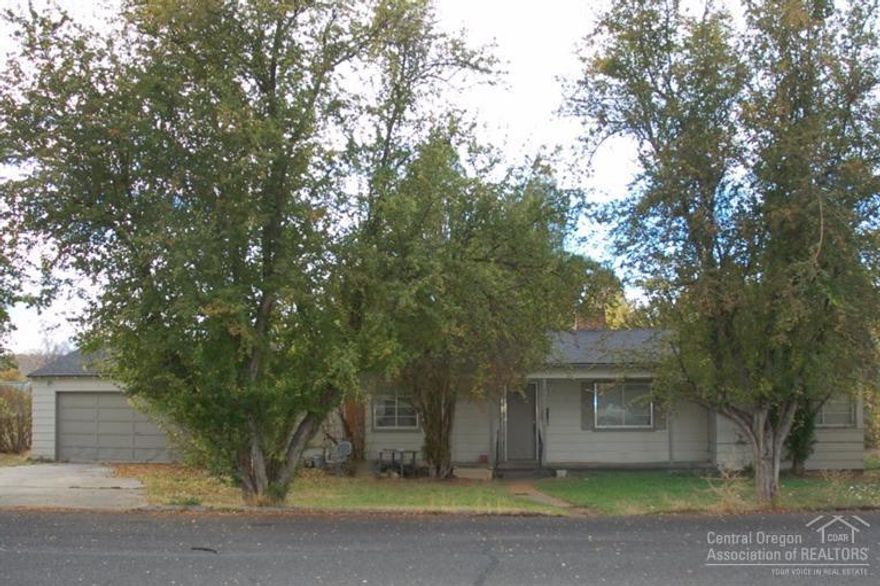 Charming home with good rental history on large corner lot. Home features hard wood floors and a real fireplace in the living room, a great breakfast nook or office space with built in shelves, a great shop area between the main living space and garage that has been used as a bedroom and a family room in the past and a two car attached garage, roof is newer.