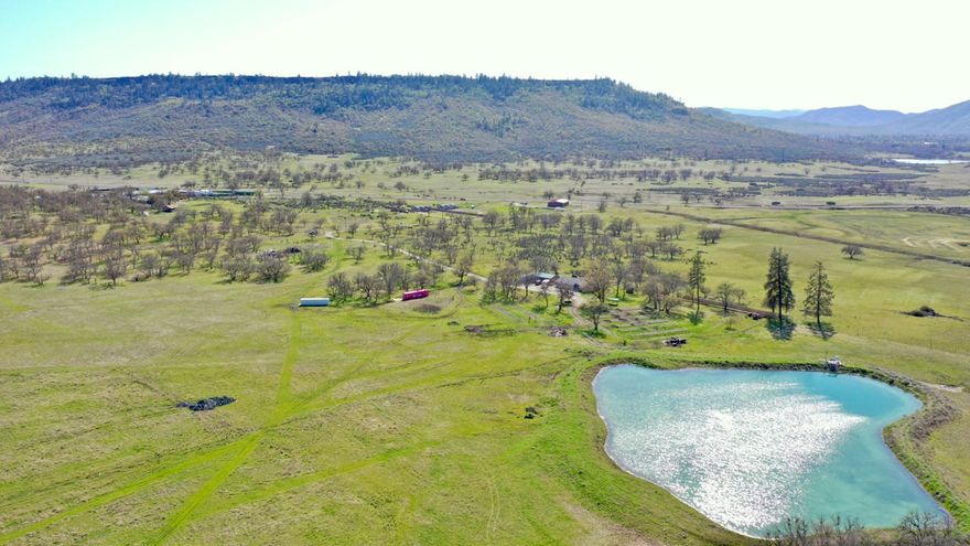 163.74 acres of private EFU zoned farmland with 47 ac of irrigation from the well and a large bulge pond. Currently, 6 raised beds with soil and are ready for the 2021 season. The irrigation system is brand new and was set up to run the 47 ac in drip irrigation. The 2015 manufactured home has an open floor plan with stainless steel appliances and a beautiful kitchen. The large three-car garage/shop has tall doors and is multi-use for all your projects. The property has stunning views of Mount McLoughlin and Upper Table Rock from literally every location on the property.