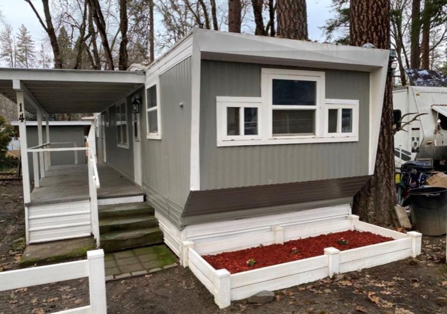 Beautiful and recently renovated manufactured home. Tucked away in a peaceful area of Gold Hill, this cozy, yet spacious home features easy access to Central Point and Medford Areas. Some of the many highlights of this one bedroom, one bath home is new hardwood floors throughout, a new HVAC system, as well as a tasteful and modern kitchen with newly built bar seating. The nice sized carpeted bedroom includes a built in dresser, excellent closet space and the bathroom has a large soaking tub, perfect for relaxing. Outside offers a large deck, partially gated front yard, two car driveway, and shed for extra storage. Call to take a tour!