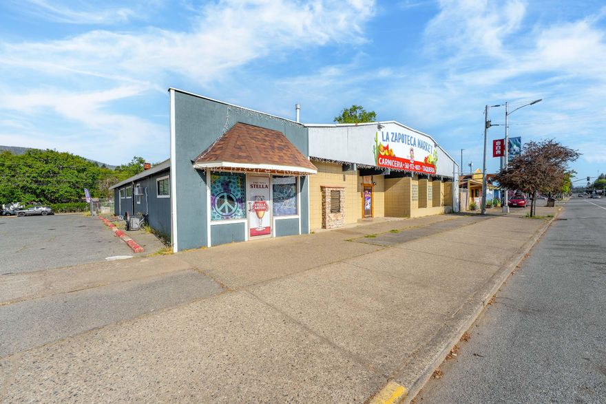 Great Commercial Location in the center of Cave Junction on the main Highway.  Vacant  Open to many business opportunities, full kitchen equipment available see private remarks.  The building is over 5000 sqft with 5 mini-splits, parking on side and back of property approx 26 parking spaces. Access through the entire lot, many options for your future business or just lease out for income.