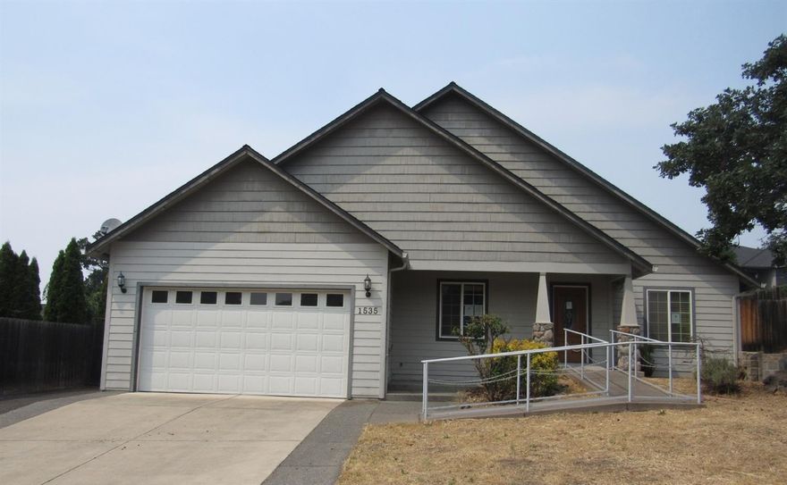 Gracious living in the 2745 square foot home build in 2004. It has 3 bedrooms, an office, 2.5 baths, slate, tile, bamboo hard and carpet flooring, vaulted ceilings, fireplace, formal dining room, roomy kitchen, granite counter-tops, 2 car garage, with extra parking for a boat, large covered patio. Needs some TLC. This is one of the best neighborhoods in East Medford.