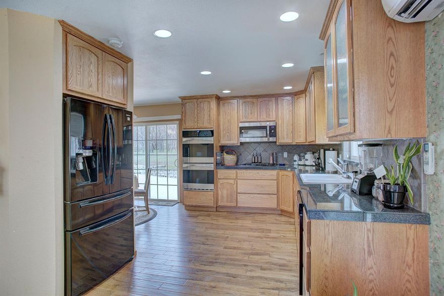 This lovely,beautifully remodeled country home has all the character, charm & comfort you could want. The 3-Bedroom, 2 full-Bath house has a kitchen any cook would love, tons of storage (includes a safe & a specially designed security storage closet), nice family room/home theater complete with surround sound, pull down screen & projector, lovely bath with zero threshold shower and a master suite with separate covered deck with an amazing view.The level 2.91 acres is completely surrounded by new fencing plus has security gate & cross fencing. It is perfect for a small farm (gardening, chickens, orchard, raising animals) or just relaxing and enjoying the peace and breathtaking surroundings. The property includes a 4-car detached garage with carport & 2 all-weather dog kennels, one with dog door into family room. The original dwelling remains on the property & is currently being used as shop by owner.It has electricity & heat. Needs work, lots of possibilities. 40 GPM Well per prior flow