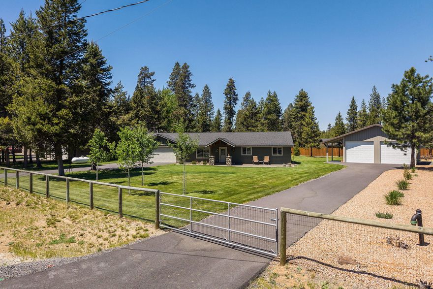 Don't miss this stunning property featuring a fully fenced yard and added privacy fence in the backyard-perfect for relaxing or entertaining. Step into your own private oasis with a heated pool, hot-tub, fire-pit and a large covered patio ideal for year-round enjoyment. The home also includes a 28X32 shop, offering plenty of space for hobbies, storage and RV parking. A new roof with heat cables ensures peace of mind through all the seasons, and a sprinkler system keeps the lush landscaping green and vibrant. Whether you're hosting summer gatherings or enjoying quiet nights under the stars, this home has everything you need and more! Short Term Rentals Allowed. Private access to the community marina on the big Deschutes River.