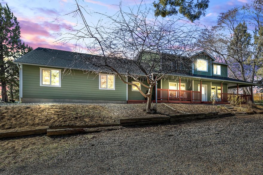 Looking for a park like setting with mature trees, 1.84 irrigated acres just on the outskirts of town? Well cared for 2982 sq ft home offers 5 bedrooms, 2 full bathroom and a half bath in the large laundry room.  Gorgeous covered front porch, you enter into a two story vaulted entry, quaint living area with propane stove offer French doors into large dining area.  Kitchen has recently been updated, bar/island, double barn door pantry and stainless steel appliances.  Sliding glass door leading out to large deck perfect for entertaining. Master on main level, soaking tub with updated tile flooring, separate shower and toilet closet. Upstairs offers, 4 additional bedrooms, 1 full bath and a large bonus room above the garage. Forced air, central a/c, attached triple car garage. A must see, move in ready, call your favorite Realtor today for your private tour before its gone!