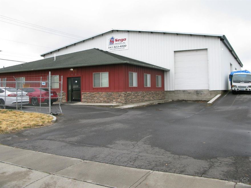 Incredible opportunity to own a large piece of the industrial area! Great industrial location close to airport and with easy access to HWY 97 Multi use building includes DOCK, warehouse and numerous offices. Large entry and reception area. Fenced and gated.