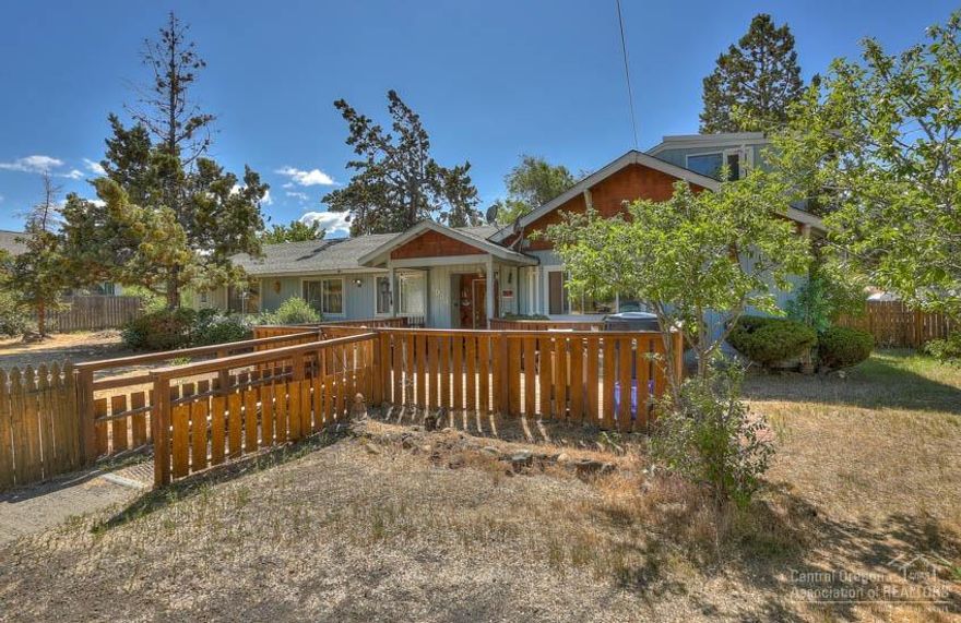 Large Home & Property in NW Bend! Possible development and/or Foster Care Home opportunities with this Half Acre lot in Bend's NW Riverside location! Big 2600sf, 8Bd/4Ba home, 2 master suites, large living room plumed for gas/wood stove with existing beautiful brick hearth, laundry/mud room, office, detached garage + small shop, Hay Barn, Gas FA Heat, plenty of room for ADU addition and RV parking too! Big corner lot(s) with access from both paved roads!