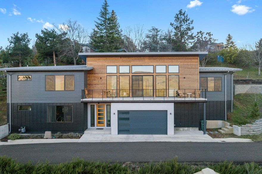 Beautiful high-end home with stunning panoramic views of the Cascades and Grizzly Peak! This contemporary designed unobstructed view home features marble backsplash in kitchen with quartz counters and beautiful wood floors. It's a great open concept with living, eating, kitchen & outdoor living spaces. This is a ''certified earth advantage'' home which means, energy efficiency, sustainability and quality all rolled into one! The main level living area has the primary bedroom with spa like bathroom and heated tiled flooring. A 2nd bedroom, laundry, full bath, kitchen & outdoor patio are on the other end of the home. Downstairs there's an en suite bedroom & large walk in closet for guests. Out Back is an easy care landscaped yard w/ room for a hot tub w/ privacy and views and TID!