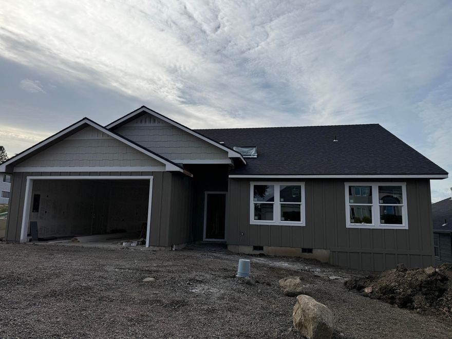 Welcome to this newly constructed home in East Medford. This residence features a split-bedroom floor plan with four bedrooms and two bathrooms. The open-concept design includes a vaulted living area that flows into a modern kitchen, complete with stainless steel appliances and a large pantry. The primary suite includes a private bathroom and walk-in closet.  Outside, the landscaped yard features automatic sprinklers, and the covered back porch offers space for outdoor enjoyment. The home is located near shopping, dining, and schools. Estimated completion 11/15/2025.

Disclosure: Listing agent holds an ownership interest in the property. The builder is VA approved.