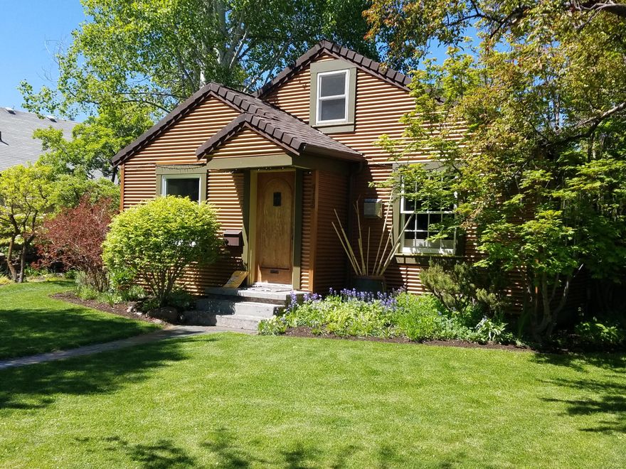 Nice Westside Cottage located on a spacious .17 acre lot (75' x 100'). Approved as Short Term Rental with transferable permit. Cozy open kitchen, dining, living space plus small attic loft. Lots of windows for natural light. Heat is provided by upright gas stove In living area. Updated kitchen and dining area. Charming bedroom with walk-in closet. Step outside and you'll enjoy the beauty and shade provided by mature fruit trees within and around the large fenced rear courtyard with sunny green house. The rear alley provides access to a small vintage, yet practical, detached garage. Step onto the entry pathway and step back in time to when Bend was still a small village.