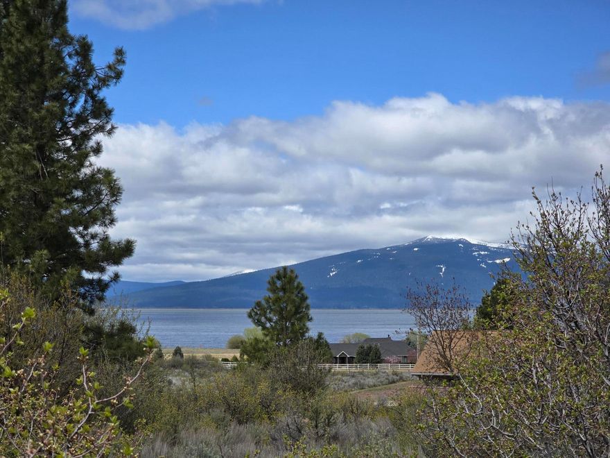 Don't miss out on your opportunity to build your dream home on this gorgeous corner lot in the Oregon Shores neighborhood! The 0.36 acre, slightly sloped lot is on the corner of Margi Way and Irving Way, and boasts a wonderful view of both Agency Lake and the mountains. Community amenities include year-round road maintenance, snow plowing in the winter, water supplied by two wells in the community, and access to a private 17 acre park with a picnic and camping areas. Utilities are located on the corner of the lot for your convenience. Just 4.1 miles to the heart of Chiloquin and 26.2 miles to Klamath Falls. Contact your favorite agent today!