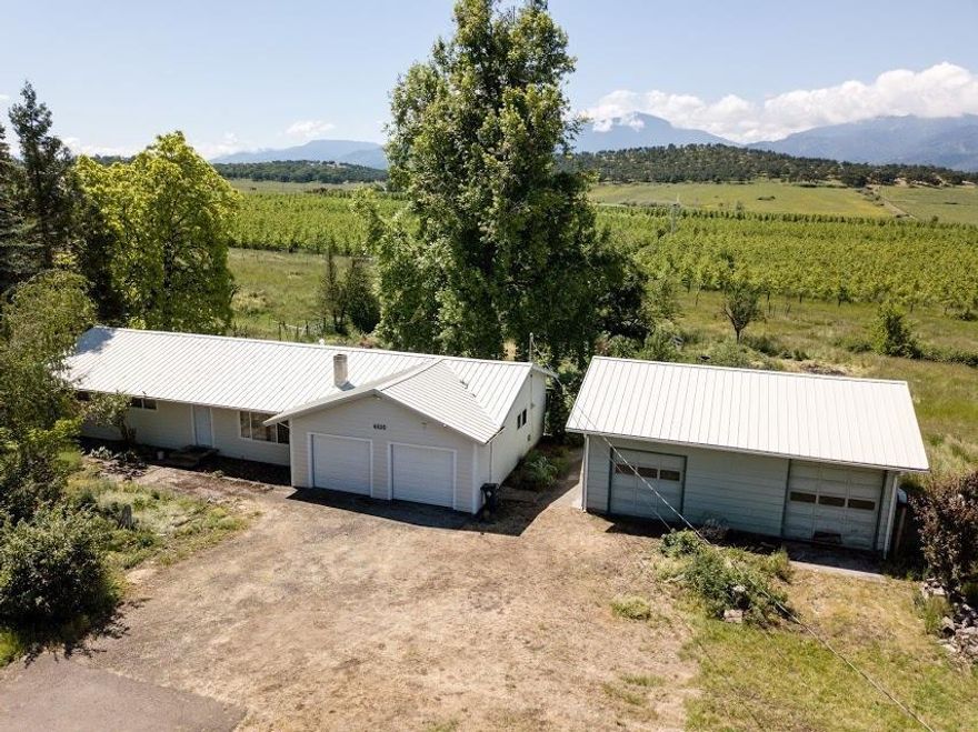 This ranch style home sits on almost 2 acres and has 1413 sq. ft of living space, amazing views as well as a great detached garage/shop. Located on Fern Valley Road this property has a great country feel to it as well as TID irrigation and great grass growing pasture land. Inside you will find a large living room, dining area with a lot of the windows taking in the full views. Views of the foothills and Mt. Ashland. Three bedrooms and two bathrooms. There is an attached two car garage also. This home needs a little TLC but the location, views, garage and are amazing.