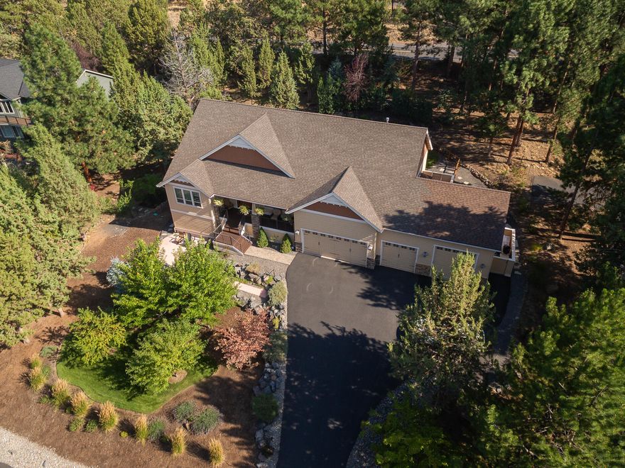 Gorgeous single level home in Wyndemere.  Natural light streams in through triple pane windows that let you connect with the outdoors. Hickory floors, lovely finishes and vaulted ceilings set the tone for this designer inspired home. Easy living with a super efficient floor plan. The great room blends perfectly with the back patio for indoor and outdoor entertaining. Enjoy casual or formal dining options. Open kitchen keeps the chef engaged with guests. Nice separation between primary and guest rooms. Light filled office offers the option to work from home. Privacy and mature landscaping on a half acre lot create a lovely oasis. Multiple outdoor living options with a covered patio and gazebo in the back yard or relax on the front porch or patio. Triple car garage plus Sprinter bay. Outdoor shed plus abundant full height storage area under the home. Easy access to all Bend amenities. Minutes to the Deschutes River Trail.  This home is a must see!