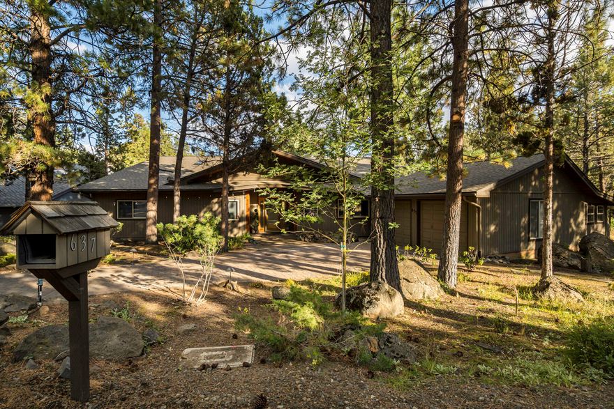 Location! Location! Location! This stunning property offers breathtaking views and tranquil surroundings on 100 feet of river frontage.  Great living area showcasing stunning vistas through large windows. The cozy fireplace adds warmth and ambiance to the space, making it the perfect spot to unwind on cool evenings. The fully equipped kitchen features modern appliances, ample counter space, and custom cherry cabinetry. The bedrooms are generously proportioned and comfortable, each offering its own unique view of the natural surroundings. Primary bedroom has an ensuite bathroom, and access to the deck. Outside, the backyard is a true oasis. You can revel in the tranquil sounds of the river while lounging on the expansive deck. The home also features a two-car garage. Located in a serene and peaceful neighborhood, close to hiking/biking trails, and adjacent to common area for added privacy, this property is the perfect retreat from the hustle and bustle of city living.